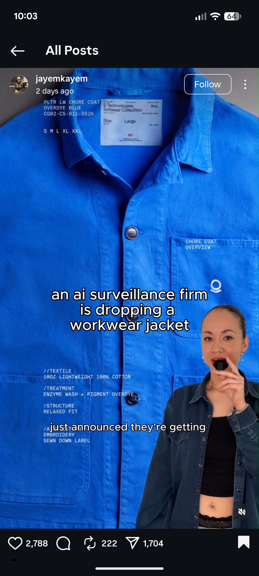 A blue workwear jacket with a visible label is featured, accompanied by text about an AI surveillance firm and a person reacting at the bottom right.